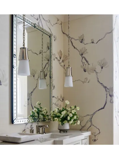 This whimsical 'Blossom' wallpaper, with its delicate floral branches, creates a pretty and serene powder room. It's a soft, artistic choice that adds a touch of nature-inspired elegance.