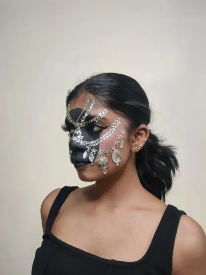 A side profile of my rhinestone mask creation, showing the detail of the placement along the cheekbones and jawline.