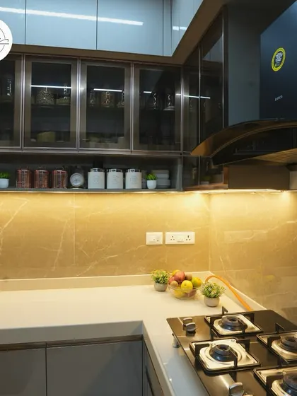 A close-up of the hob and the organized spice rack in this modern kitchen.
