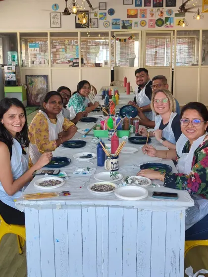 A team from a local tech company enjoying our resin koi pond workshop. It's a perfect activity for corporate groups looking for a relaxing and creative team-building experience.