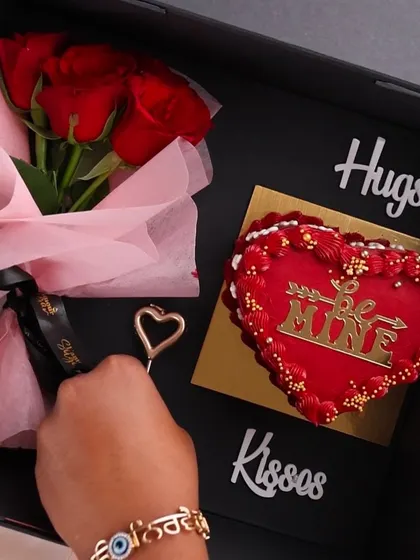 Our 'Be Mine' Valentine's hamper is the ultimate romantic gesture. It includes a heart shaped cake, a beautiful bouquet of red roses, and comes in an elegant surprise box.