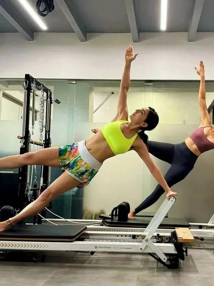 Pilates is even more fun with a partner. Here, Sara Ali Khan and I perform the 'Star' on the Reformer, a challenging exercise that requires synchronization, core strength, and trust. It’s a great example of how we can make workouts both demanding and enjoyable.