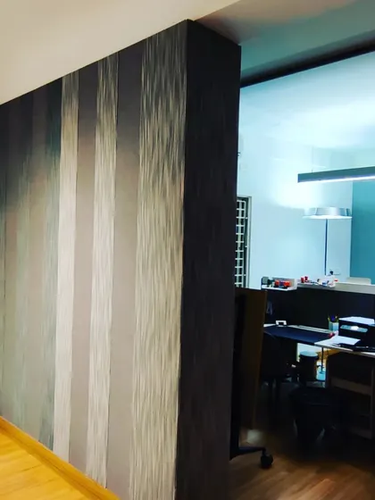 A wide shot of a striped acoustic panel wall, demonstrating how it can be used as a feature wall in an office interior.