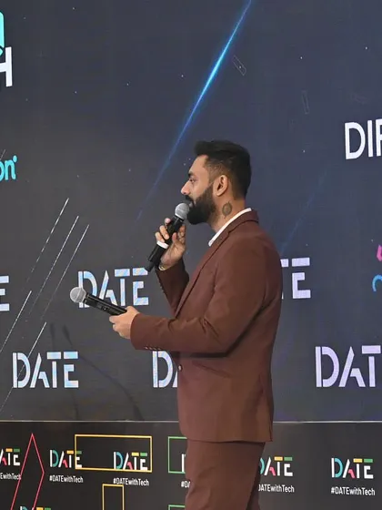On stage at the World Fintech Show, holding my notes and addressing the audience. This shot highlights my role as the main anchor, guiding the event and introducing various segments and speakers.