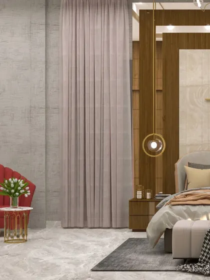 A view of the seating area, where the texture of the curtains and the sheen of the side table add to the room's luxurious feel.