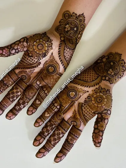 A playful and modern design with asymmetrical patterns on each hand, combining mandalas, hearts, and floral elements.