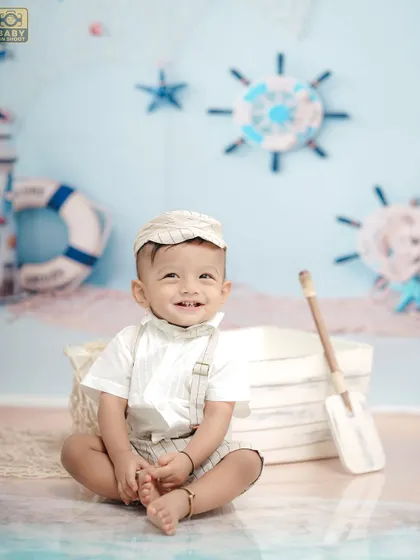 A happy little sailor enjoying his sea adventure. The light and airy color palette gives this theme a fresh, cheerful feel.