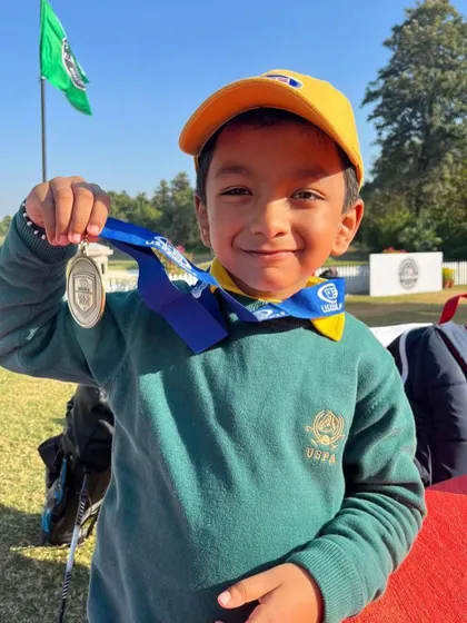 A close up of Samar with his first gold medal. He started learning just four months ago, and his rapid progress is a testament to his dedication and our focused training program.