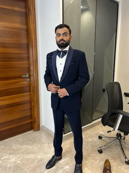 A confident stance from a groom ready for his reception. The subtle details, like the patterned bow tie and lapel, are enhanced by my professional grooming service.