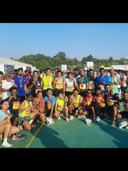 The whole crew celebrating after a successful TCS World 10k race. It's a great feeling to see everyone's hard work pay off.