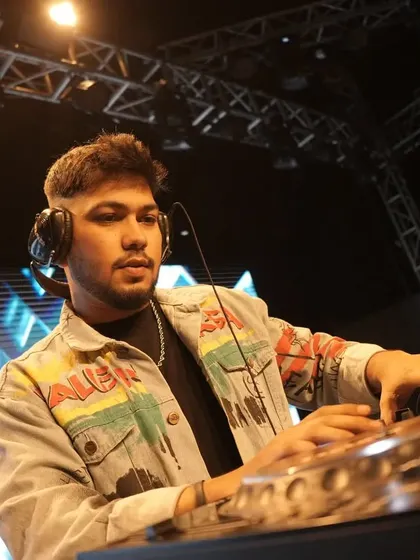 In the zone, with headphones on, preparing the next track.