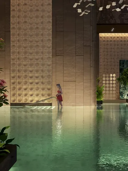 A child wades in the shallow end of the Palais Royale pool. This detail highlights our focus on creating family-friendly luxury, with spaces designed for the comfort and enjoyment of all residents.
