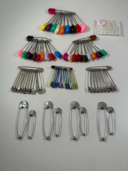 A look at the variety of safety pins included in my draping kit. I have included different sizes and types for every possible need during draping.