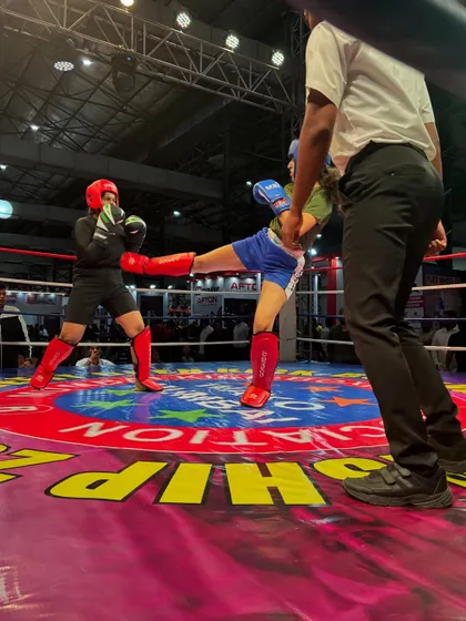 A perfectly executed kick during a tournament match. We train not just for power, but for precision and timing to score points and control the fight.