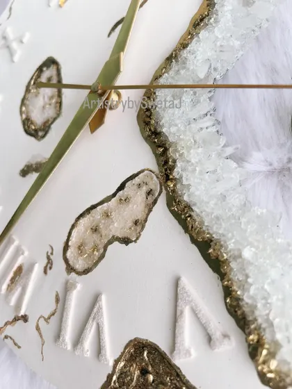 A close-up of my geode fusion clock, showing the sparkling clear crystals and gold accents against the premium white gypsum base.