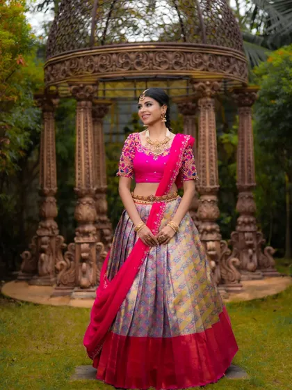 Another view of the Kanjeevaram half saree, highlighting the beautiful setting and the grandeur of the outfit.