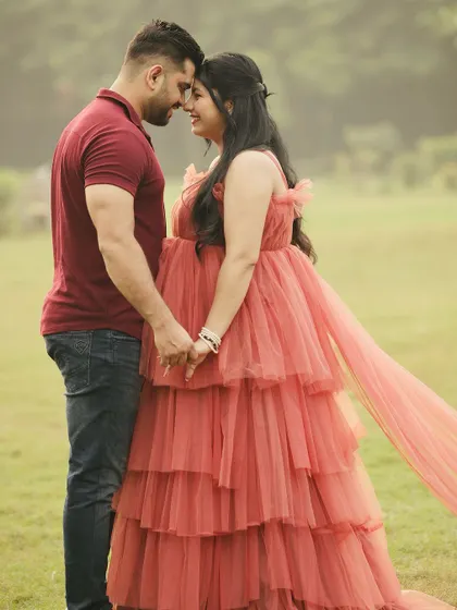 An intimate and romantic pose from the maternity shoot. The long trail of the gown adds a beautiful visual element to the composition.