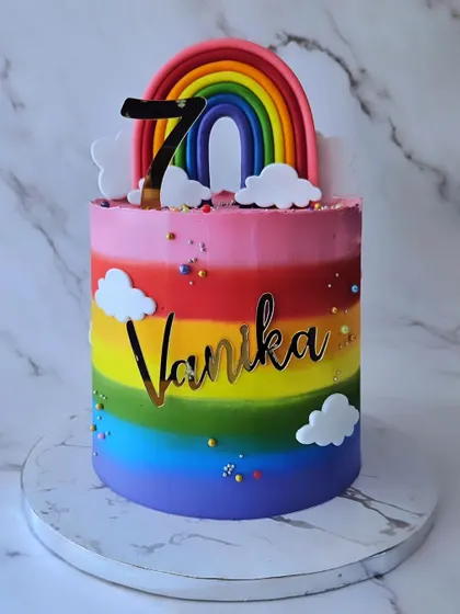 Vibrance! A rainbow cake inside and out for Vanika's 7th birthday. The colorful layers are as fun as the outside decoration.