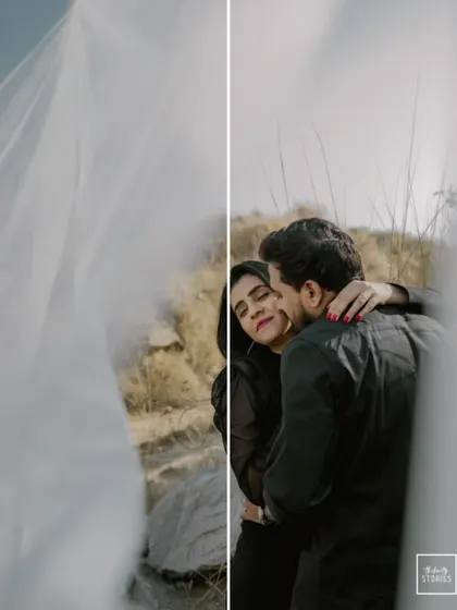 An artistic shot through a flowing white veil. This creative framing adds a touch of mystery and romance to this intimate embrace in a natural setting.