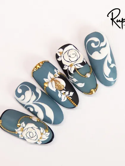 Another view of the blue and gold baroque set, highlighting the intricate details of the 3D roses and hand-placed gold beads.