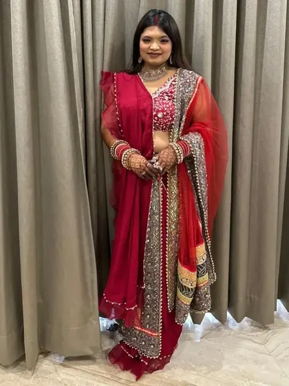 A stunning Karwa Chauth look in a beautiful red saree. The makeup is glamorous yet elegant, perfect for the occasion.