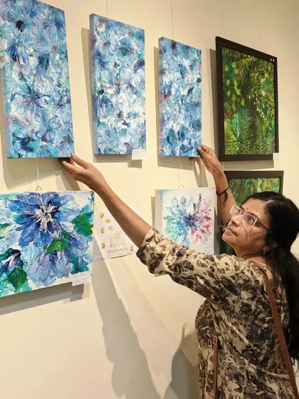 Hanging up my paintings at the gallery.