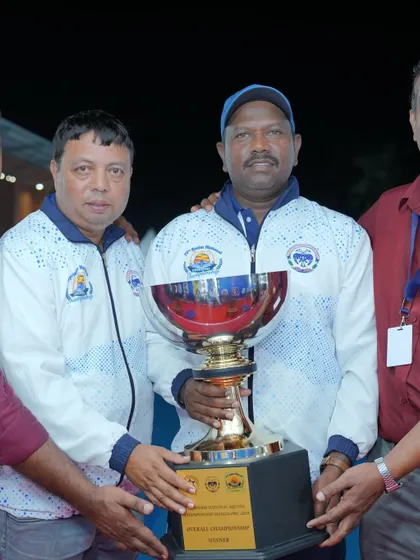 Our coaches holding the overall championship trophy.