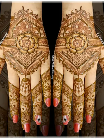 A bold and beautiful design featuring a large central flower, jhumka details, and intricate patterns on the fingers.