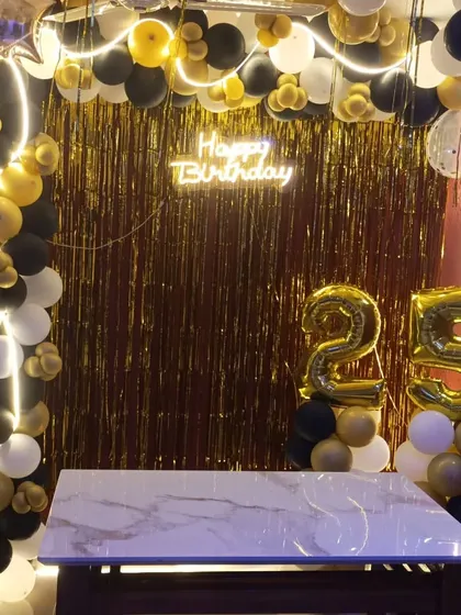 A closer look at the 25th birthday home setup, ready for a cake-cutting ceremony.