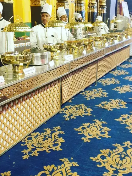 A consistent and professional presentation is key. This image shows our staff and setup, ensuring every detail from the food to the service is impeccable.
