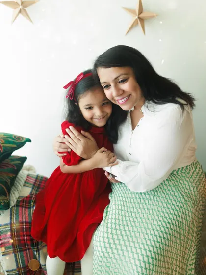 A heartwarming hug between a mother and her daughter during a Christmas session. These are the moments of holiday magic and love that I cherish capturing.