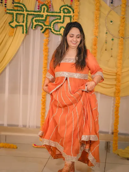 A candid shot of the bride dancing and enjoying her Mehandi function.