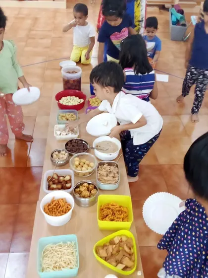A community snack table during our Holi celebration. Sharing food is an integral part of every festival at our school.