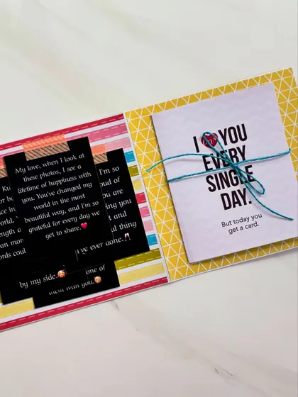 This flipbook page includes a personal, handwritten-style letter and a small card, adding a deeply personal touch to the photo album.