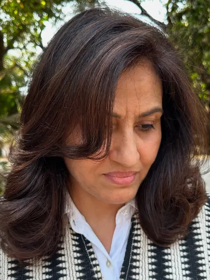A portrait of a client with her 'Chocolate Truffle' hair.