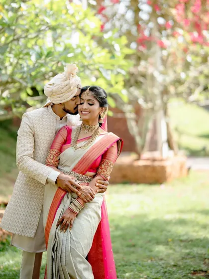 A beautiful couple portrait of my bride Sushma, looking radiant in an off-white and pink Kanjivaram saree with a custom embroidered blouse.