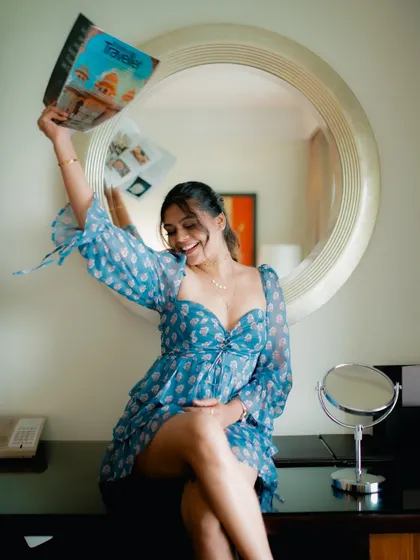A duplicate of image 316, this playful and happy portrait of a model with a magazine is fun and engaging.