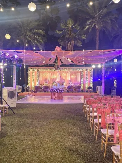 A full view of a reception setup, including the stage, guest seating, and lighting. This shows how all the elements come together to create a cohesive and beautiful event space.
