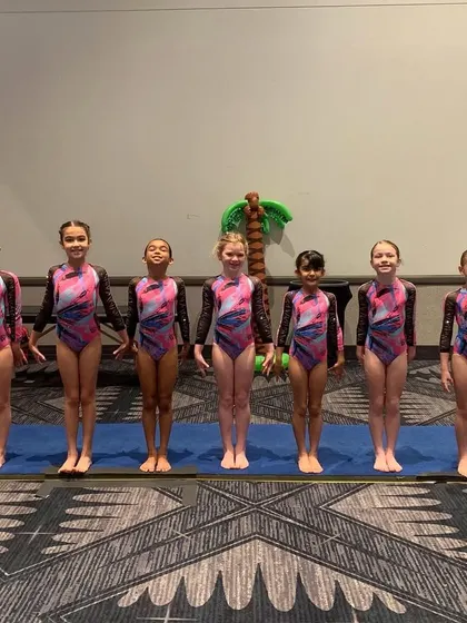 Our younger Xcel athletes looking sharp and ready to compete at the Luau Invitational.