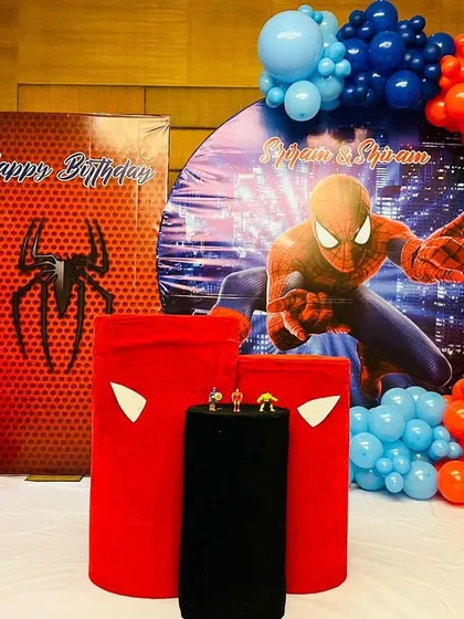 A close-up of a Spiderman themed decoration, showing the detailed plinths and backdrops used to create an immersive experience.