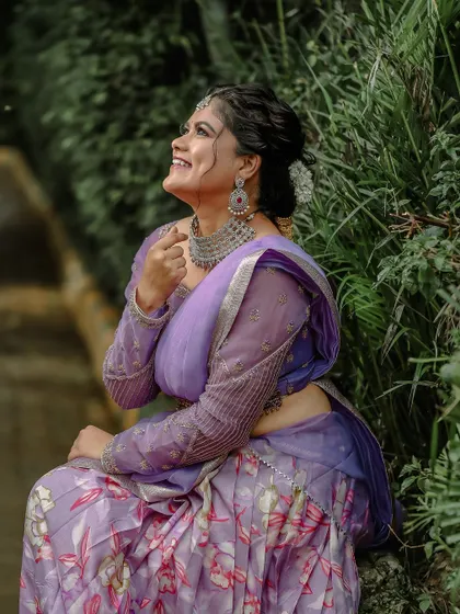 A candid moment captured in our beautiful lavender half saree, perfect for creating lasting memories.