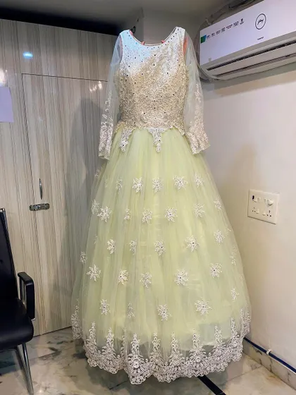 A clear, full-length image of the elegant pastel ballgown, showcasing its timeless design and intricate embroidery.