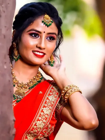 A close-up of the reception makeup for this client. I used a bright red lip and green-toned jewellery to create a beautiful contrast with her red and gold lehenga.