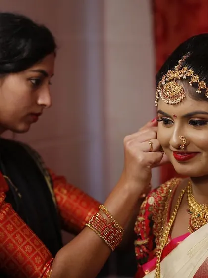 A behind the scenes shot of me putting the final touches on a bride's muhurtham look. Precision and attention to detail are key to creating that perfect, traditional bridal glow.