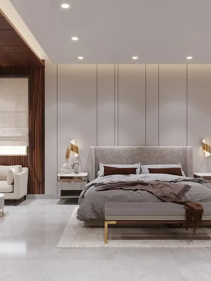 A full view of a bespoke bedroom, complete with a seating area. The design uses a consistent palette of beige, grey, and wood, with gold accents for a touch of elegance, creating an everlasting and sophisticated design.