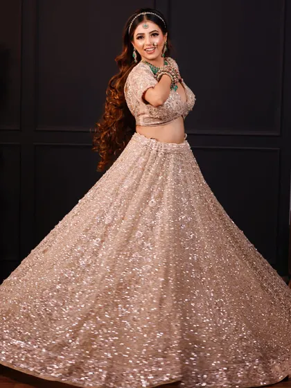 A fun, twirling shot of the bride, showing the beautiful flare of her lehenga.