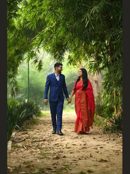 A duplicate of image 7, capturing a couple's romantic walk in a park.