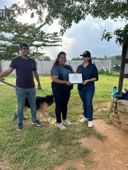With my mentor and my dog on certification day. This represents the partnership between owner, trainer, and dog that is essential for success.