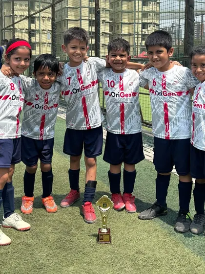 The future of OriGen. Our U7 players posing for a team photo, showcasing the camaraderie and spirit of our youngest batch.