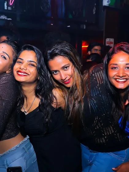 A group of friends smiling and laughing together.